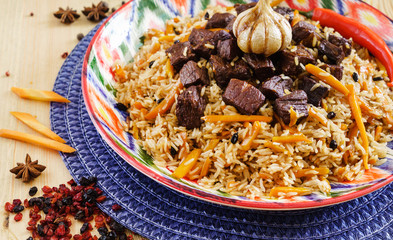 Pilaf with mutton, carrots, onions, garlic, pepper and cumin. A traditional dish of Asian cuisine.