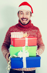 Portrait of Man in hat with gifts at Christmas