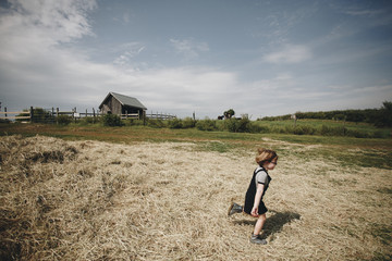 Little girl playing in a farm