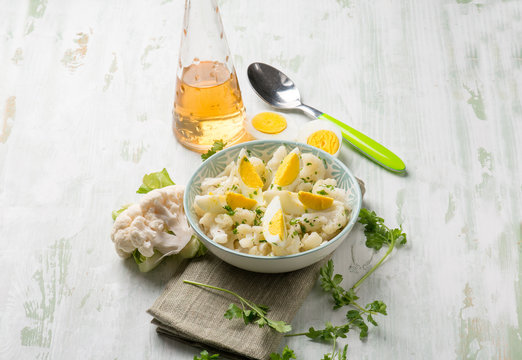 cauliflower salad with boiled eggs and parsley