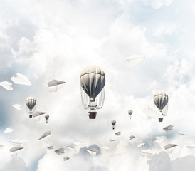 Flying hot air balloons in the air.