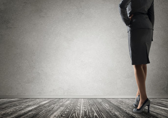 Businesswoman looking at wall