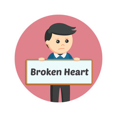 Man holding broken heart sign