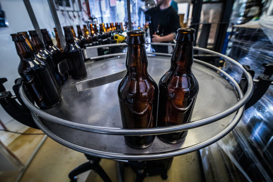 Line and bottles on microbrewery
