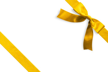 Gold bow satin golden ribbon band stripe fabric on corner (isolated on white background with clipping path) for Christmas holiday gift box present wrap design decoration ornament element
