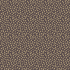 Seamless vector background with random golden elements. Abstract ornament. Dotted abstract pattern