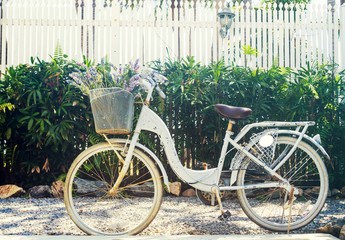 Fototapeta na wymiar Vintage filtered: Bicycle parking in house outdoor, classic bike in the garden