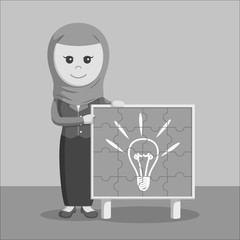 Black and white arab businesswoman with idea puzzle board
