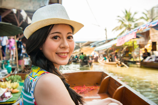 woman traveler taking boat visiting Thailand