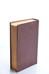 Old book stands on white