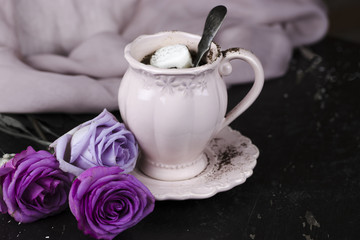 A cup of coffee with marshmallow for breakfast