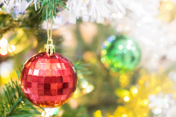 Christmas ornament ball decorate on pine tree copy space blur background for Xmas New Year festival.