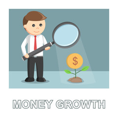 Businessman giving light to his money plant with magnify glass money growth photo text