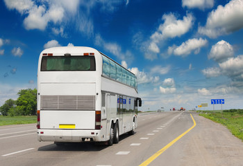 tourist bus on the asphalt road. Excursion with tourists