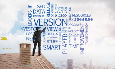 Young businessman standing on house roof and writing leadership skill concept. Mixed media