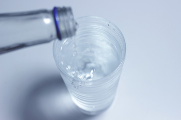 Pouring of water into a glass