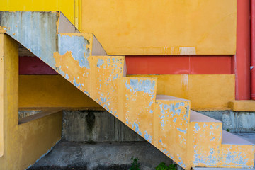 Close up old staircase cement yellow color texture background