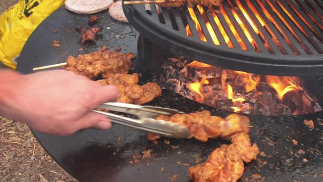 barbecue Livar pork chicken kebab turning the meat