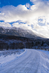 beautiful landscape with winter mountain road