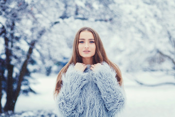 Outdoor portrait of young beautiful happy girl walking on street