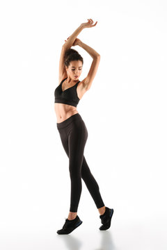 Full length image of Sensual fitness woman posing
