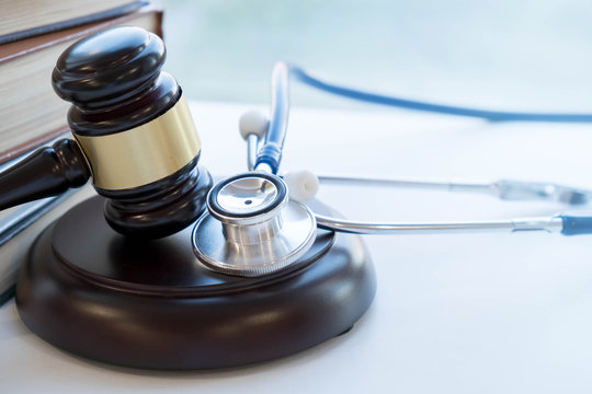 Gavel And Stethoscope. Medical Jurisprudence. Legal Definition Of Medical Malpractice. Attorney. Common Errors Doctors, Nurses And Hospitals Make