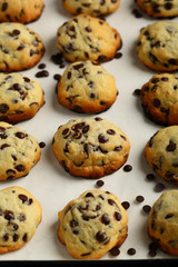 Cookies with chocolate chips on baking sheet