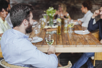 Friends Having Lunch Together at Restaurant