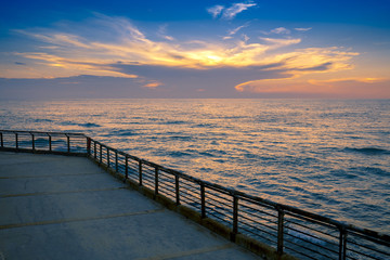 Fototapeta na wymiar Seashore in evening. Beautiful sunset over sea
