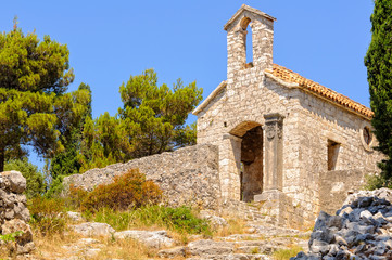 Fototapeta na wymiar Small hilltop chapel above the old town - Hvar, Croatia