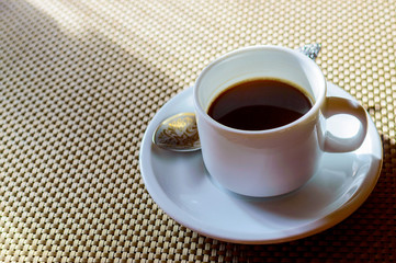 Obraz na płótnie Canvas Black coffee in white cup