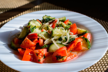 Vegetable salad. Plate of salad with vegetables. Assortment of ingredients of vegetable salad