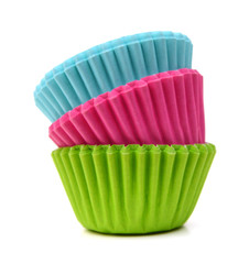 Colorful cupcake paper cups on white background