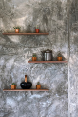 Concrete wall background texture grunge and grey surface with shelves and accessories, empty space for add text or image. Loft style.