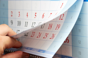 Man looking at the wall calendar