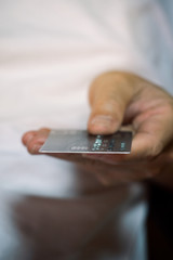 Male hand showing credit card, close up