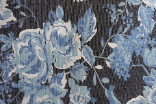Fabric with blue floral pattern from above