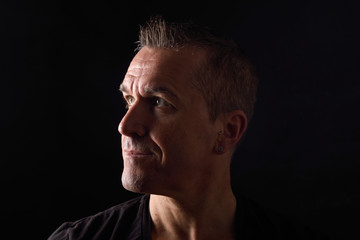 portrait of a man on black background