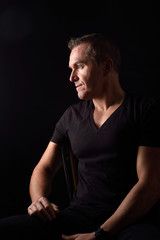 Naklejka premium portrait of a man on black background