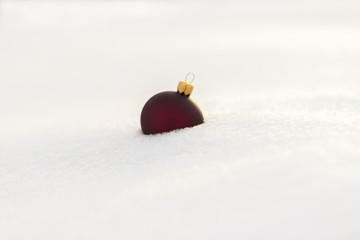 Christmas ball on snow outside