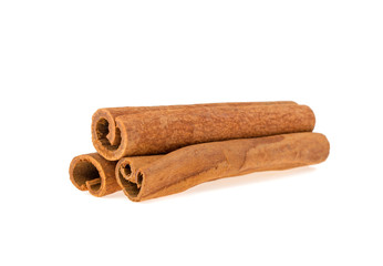 three cinnamon sticks isolated on white background