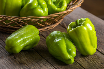 Green bell pepper in wicker basket