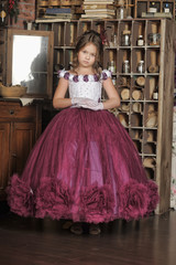 Vintage portrait of little girl in purple dress