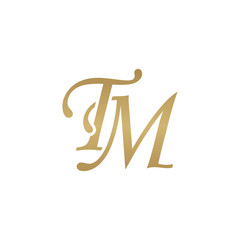 Initial letter TM, overlapping elegant monogram logo, luxury golden color