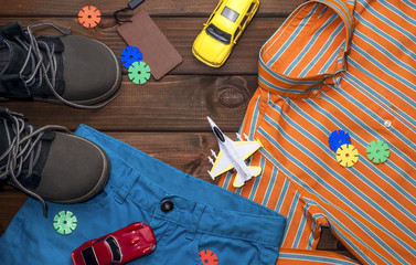 beautiful bright clothes for a boy on a brown background