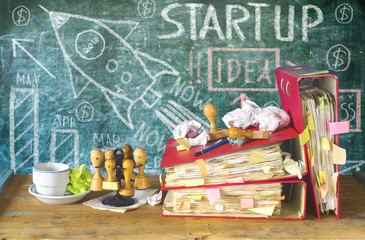 Business start up, messy file folders,stamps, bureaucracy, red tape concept