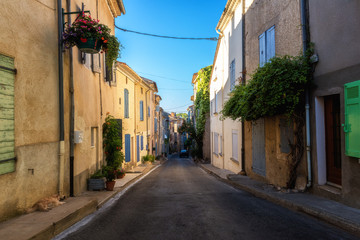 Fototapeta na wymiar Sunny street of Valensole, small cozy french medieval town in the heart of Provence, Provence-Alpes-Cote d'Azur, France