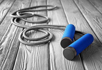 Jumping rope on wooden background