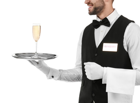 Waiter holding metal tray with glass of champagne on white background, closeup