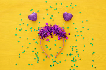 Top view image of funny party head glitter accessory with hearts. Flat lay. Purim celebration concept (jewish carnival holiday).